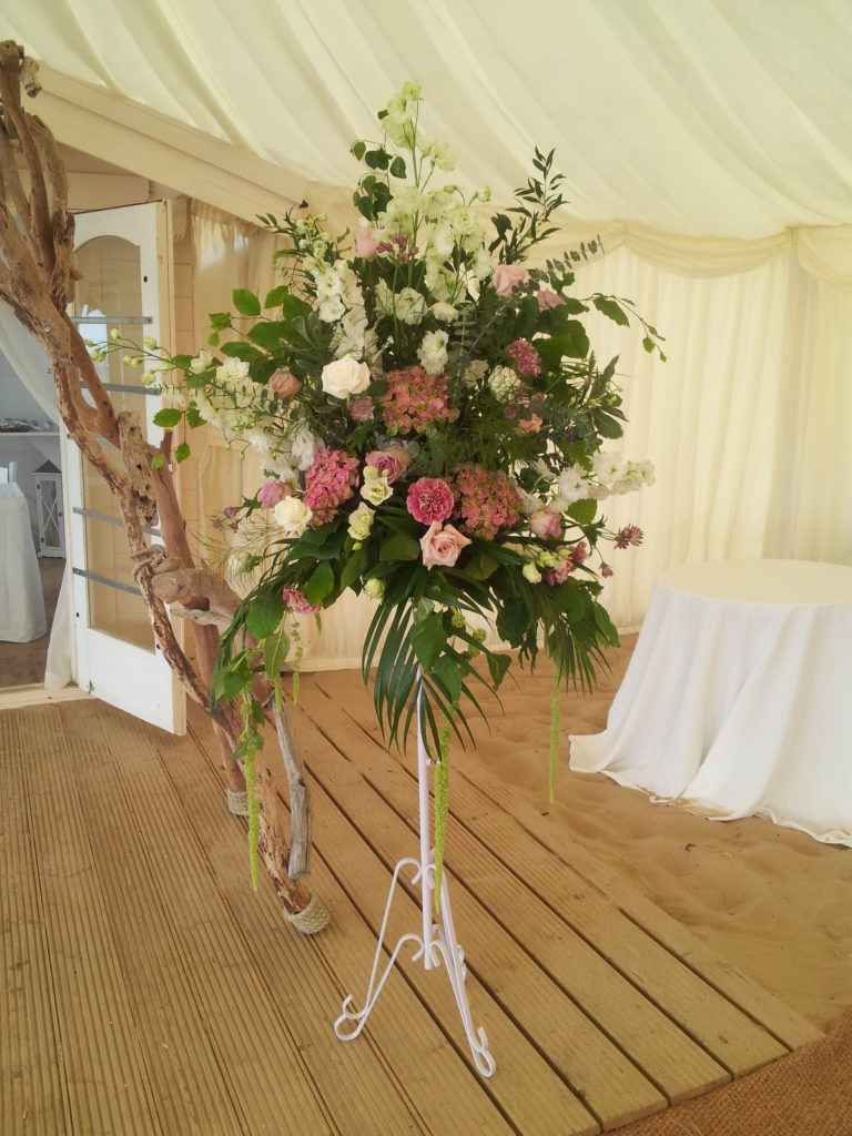 Ceremony pedestal with pink flowers