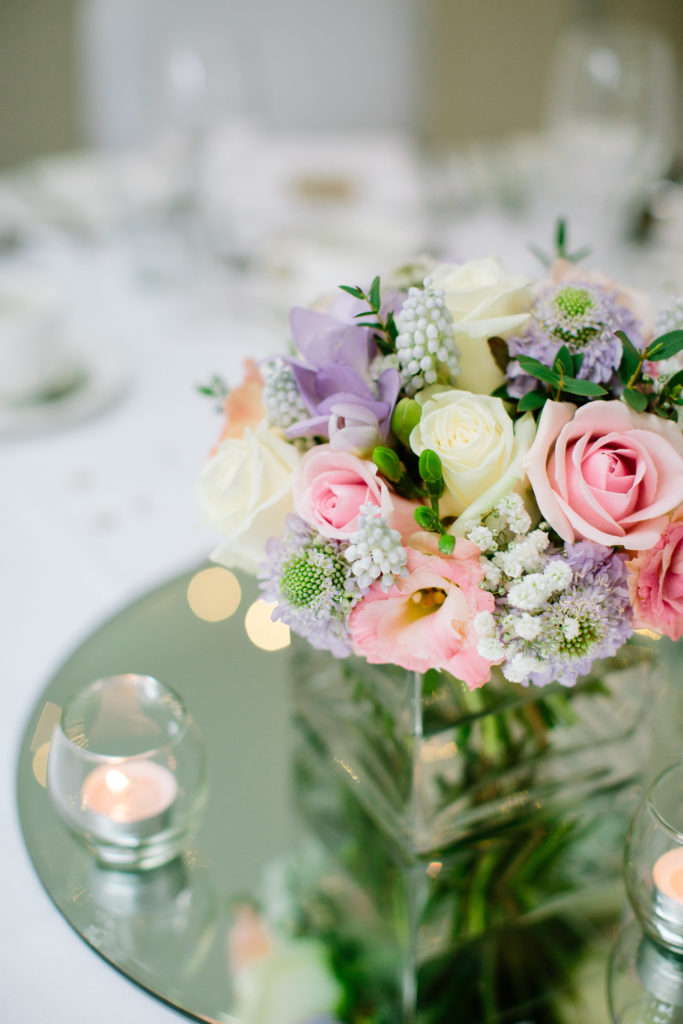 Pastel wedding reception flowers in Dorset