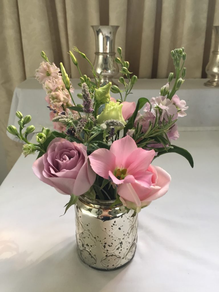 Wedding ceremony flowers in Dorset. Flower filled jar