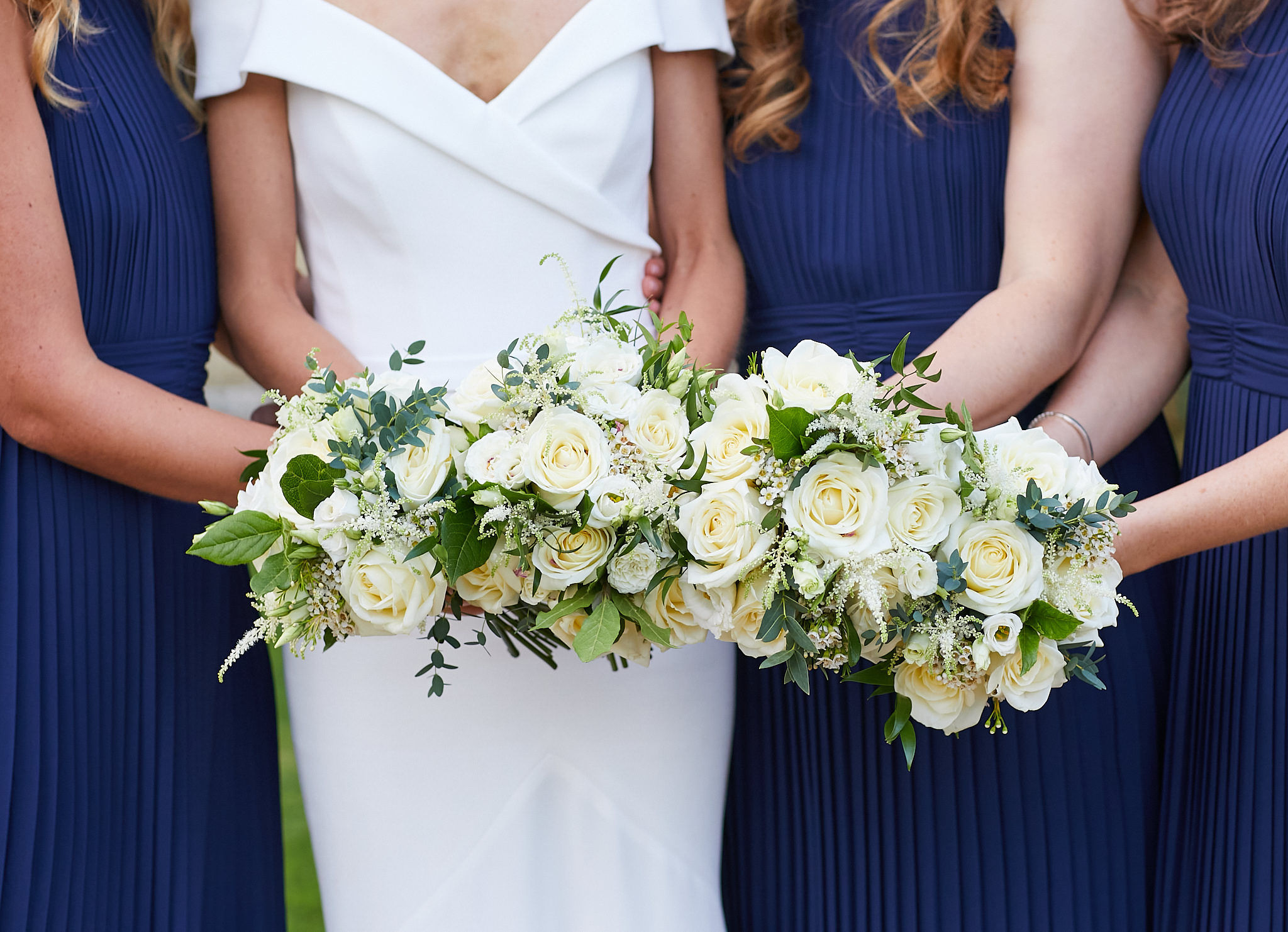 Bride and bridesmaids holding their bouquets